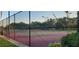 Tennis court with black chain-link fence at 7102 52Nd E Dr, Bradenton, FL 34203