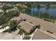 An aerial view showcasing the villa community and beautiful serene lake views at 7118 Lakeside Dr # 7118, Sarasota, FL 34243