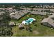 Overhead view of property and community pool, gazebo, and meticulously maintained landscaping at 7118 Lakeside Dr # 7118, Sarasota, FL 34243