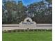 Welcome to Palm Aire Country Club sign, enhanced by lush greenery and landscaping at 7118 Lakeside Dr # 7118, Sarasota, FL 34243