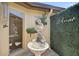 Enchanting courtyard featuring a charming fountain, lush greenery, and a welcoming atmosphere at 7118 Lakeside Dr # 7118, Sarasota, FL 34243