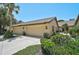 Charming single-story home featuring a 2-car garage, manicured landscaping, and a welcoming entrance at 7118 Lakeside Dr # 7118, Sarasota, FL 34243