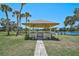 Charming gazebo overlooking the water, offering a serene spot to relax and enjoy the view at 7118 Lakeside Dr # 7118, Sarasota, FL 34243