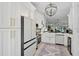 Contemporary kitchen featuring white cabinetry, stainless steel appliances, and an open layout at 7118 Lakeside Dr # 7118, Sarasota, FL 34243