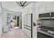 Updated kitchen with stainless appliances, white cabinets, and slider access to a peaceful patio at 7118 Lakeside Dr # 7118, Sarasota, FL 34243