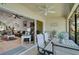 Relaxing screened-in lanai with ceiling fans and view into the open living area at 7118 Lakeside Dr # 7118, Sarasota, FL 34243