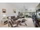 Spacious living room with stylish decor, comfortable seating, and scenic views of the lake at 7118 Lakeside Dr # 7118, Sarasota, FL 34243