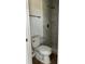 This bathroom has a toilet with tiled shower with a rain shower head and built-in shelf at 8412 Grove Blvd, Punta Gorda, FL 33982