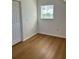 Bedroom with window and wood floors at 8412 Grove Blvd, Punta Gorda, FL 33982
