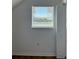 Bright bedroom featuring a window with blinds and a view of the outdoors plus a folding door closet at 8412 Grove Blvd, Punta Gorda, FL 33982