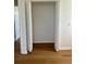 Open closet with bi-fold doors and wood floors at 8412 Grove Blvd, Punta Gorda, FL 33982