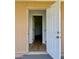 An open doorway with wood flooring and a view into other rooms is the focus at 8412 Grove Blvd, Punta Gorda, FL 33982