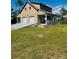 Inviting two-story home with a spacious two-car garage and charming front porch at 8412 Grove Blvd, Punta Gorda, FL 33982
