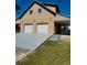 Two-story home featuring a two-car garage and covered porch, set on a well-maintained lawn at 8412 Grove Blvd, Punta Gorda, FL 33982