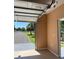 View of the open garage door and epoxy flooring, offering a seamless transition to the great outdoors at 8412 Grove Blvd, Punta Gorda, FL 33982