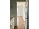 Bright hallway features wood floors and fresh white walls at 8412 Grove Blvd, Punta Gorda, FL 33982
