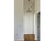 Bright hallway with chandelier and wood floors at 8412 Grove Blvd, Punta Gorda, FL 33982
