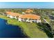 Aerial view of condo community and lush landscape at 8422 Wethersfield Run # 103, Lakewood Ranch, FL 34202
