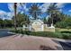 Entrance to Lakewood Ranch Golf and Country Club features lush landscaping and brick-paved street at 8422 Wethersfield Run # 103, Lakewood Ranch, FL 34202