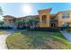 Well-maintained condo with lush lawn, manicured hedges, and covered balconies at 8422 Wethersfield Run # 103, Lakewood Ranch, FL 34202