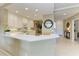 Modern kitchen featuring white cabinetry, sleek countertops, and stainless steel appliances at 8422 Wethersfield Run # 103, Lakewood Ranch, FL 34202