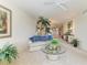 Cozy living room with ceiling fan, comfortable seating, and open floor plan at 8422 Wethersfield Run # 103, Lakewood Ranch, FL 34202