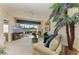 Comfortable living room with golf course view, ceiling fan, and stylish furnishings at 8422 Wethersfield Run # 103, Lakewood Ranch, FL 34202