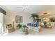 Bright living room with ceiling fan, neutral tones, golf course view, and inviting decor at 8422 Wethersfield Run # 103, Lakewood Ranch, FL 34202