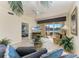 Relaxing living room featuring golf course view, ceiling fan, and comfortable seating at 8422 Wethersfield Run # 103, Lakewood Ranch, FL 34202