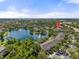 Aerial view of the community and surrounding green spaces and lake at 8926 Manor Loop # 201, Lakewood Ranch, FL 34202