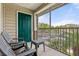 Relaxing balcony with seating and view of the community at 8926 Manor Loop # 201, Lakewood Ranch, FL 34202