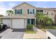Charming two-story townhome with attached garage, and a screened in lanai with lush landscaping at 8926 Manor Loop # 201, Lakewood Ranch, FL 34202