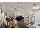 Open-concept living room with a kitchen, and a balcony at 8926 Manor Loop # 201, Lakewood Ranch, FL 34202