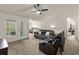 Bright living room with access to balcony and adjoining office at 8926 Manor Loop # 201, Lakewood Ranch, FL 34202