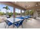 Comfortable outdoor seating area with tables and chairs, perfect for dining and relaxation, overlooking the community pool at 8926 Manor Loop # 201, Lakewood Ranch, FL 34202