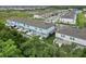 New townhome community features lush green landscaping and plentiful parking at 9064 Driven Snow St, Sarasota, FL 34241