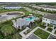An aerial shot of the neighborhood pool with a pool house and luscious landscaping at 9064 Driven Snow St, Sarasota, FL 34241