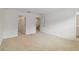 Spacious bedroom with carpeted floors and views into the ensuite bathroom and walk-in closet at 9064 Driven Snow St, Sarasota, FL 34241