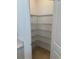 Walk-in pantry features ample metal shelving for organized storage space at 9064 Driven Snow St, Sarasota, FL 34241