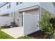 View of a small fenced-in patio with a modern air conditioning unit adjacent to the rear of the home at 9064 Driven Snow St, Sarasota, FL 34241