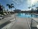 Relaxing lounge chairs line the community pool under a sunny sky at 9064 Driven Snow St, Sarasota, FL 34241