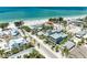 Fantastic aerial view capturing homes near the beachfront with turquoise ocean views at 104 Magnolia Ave, Anna Maria, FL 34216