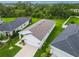 A modern home with a gray roof, well-maintained lawn, and an attached two-car garage at 10962 High Noon Trl, Parrish, FL 34219