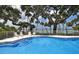 Beautiful pool with bay views and mature trees in a serene and inviting setting at 1100 Imperial Dr # 507, Sarasota, FL 34236