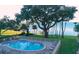 Beautiful waterfront pool surrounded by mature trees and views of the bay at 1100 Imperial Dr # 507, Sarasota, FL 34236