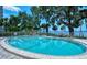 Enjoy this sparkling community pool with views of the bay and mature, tropical landscaping at 1100 Imperial Dr # 507, Sarasota, FL 34236