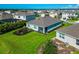 Aerial view of the home's backyard, showcasing lush green grass and landscaping at 12712 Dusty Trail Dr, Sarasota, FL 34238