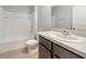 Bathroom features a single sink vanity, a bathtub and shower combination and tile floors at 12712 Dusty Trail Dr, Sarasota, FL 34238