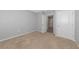 Empty bedroom with neutral walls and carpeted floor, featuring doorways and a closet at 12712 Dusty Trail Dr, Sarasota, FL 34238