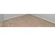 Angled view of carpeted bedroom flooring and neutral baseboards at 12712 Dusty Trail Dr, Sarasota, FL 34238